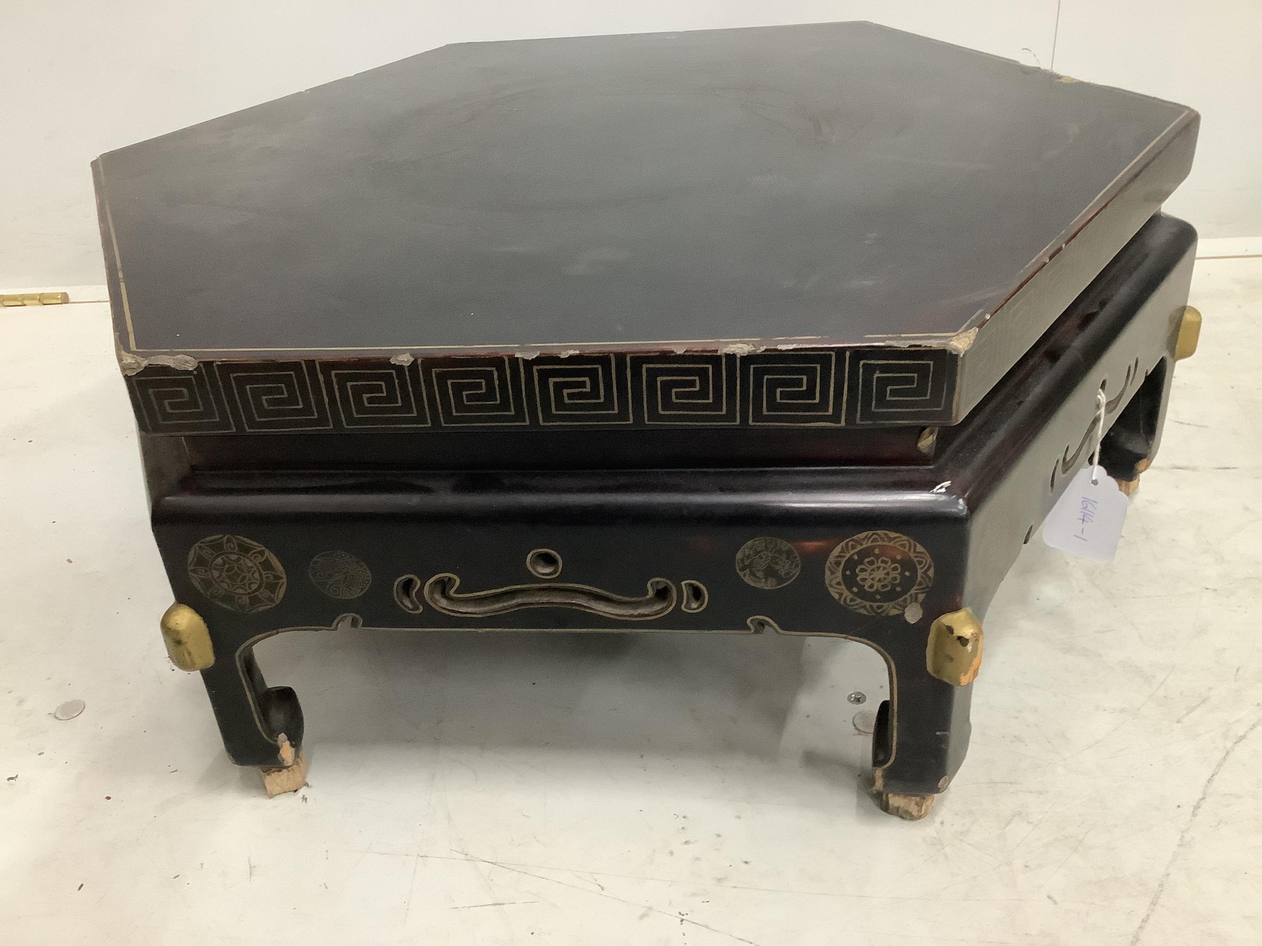 A Chinese black lacquered hexagonal stand, width 57cm, height 28cm. Condition - poor, chipping around the edges